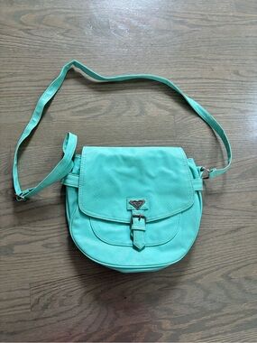 Roxy turquoise crossbody bag with magnetic buckle flap closure